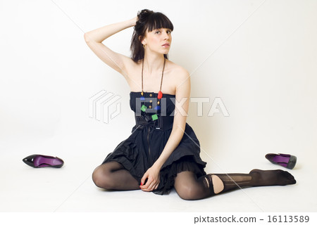 Young woman in torn stockings 16113589