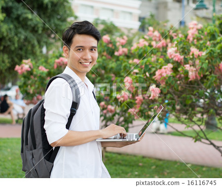Happy smiling college student with laptop 16116745