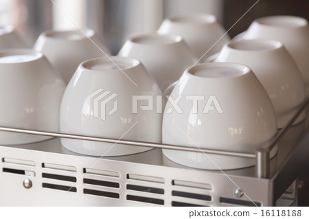 Empty coffee cup on coffee machine Empty coffee cup on coffee machine 16118188