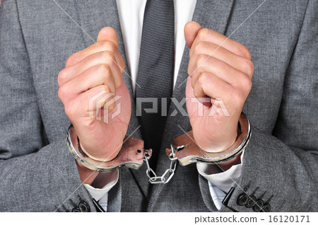 handcuffed man handcuffed man 16120171
