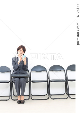 A woman waiting for turns 16126147