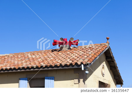 Fire siren on house roof 16135647