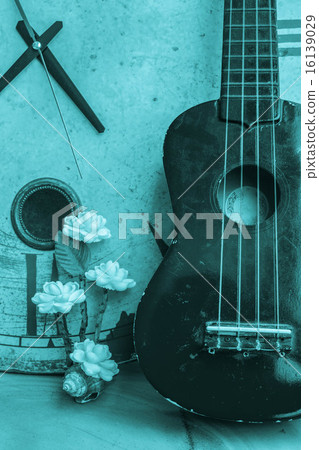 Ukulele on a black and white background. Ukulele on a black and white background. 16139029