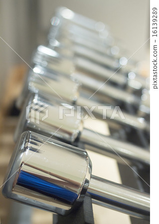 Dumbbell gym metal weights in gym health club 16139289