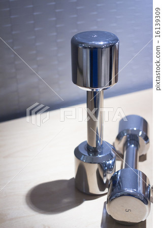 Dumbbell gym metal weights in gym health club Dumbbell gym metal weights in gym health club 16139309