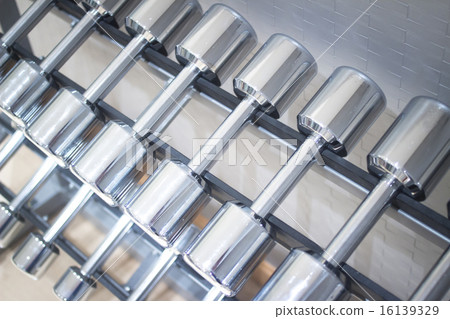 Dumbbell gym metal weights in gym health club 16139329