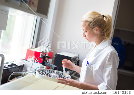 Scientist working in analytical laboratory. Scientist working in analytical laboratory. 16140398