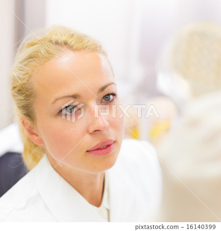 Scientist observing petri dish. Scientist observing petri dish. 16140399