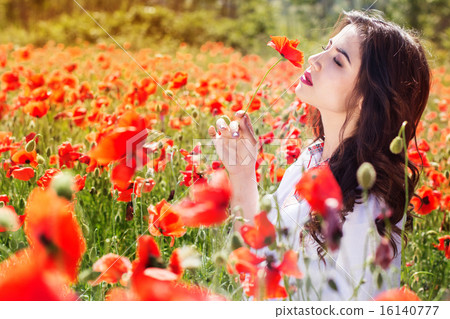 Fashion portrait of girl near red roses Fashion portrait of girl near red roses 16140777