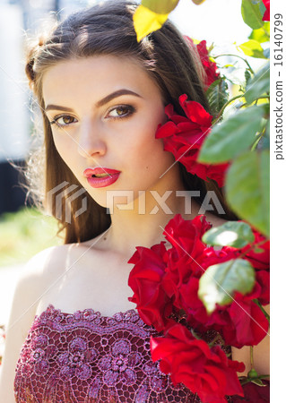 Portrait of fashion girl near red roses Portrait of fashion girl near red roses 16140799