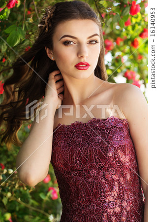 Fashion portrait of girl near red roses Fashion portrait of girl near red roses 16140953