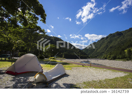 Camping along the river 16142739