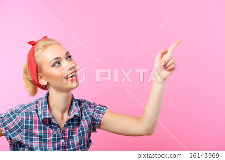 Beautiful pin up girl isolated on pink Beautiful pin up girl isolated on pink 16143969