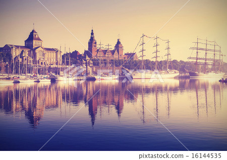 Vintage style sailing ships at sunrise. Vintage style sailing ships at sunrise. 16144535