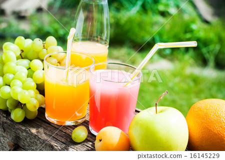 Fresh Juice in Glasses and Fruits 16145229
