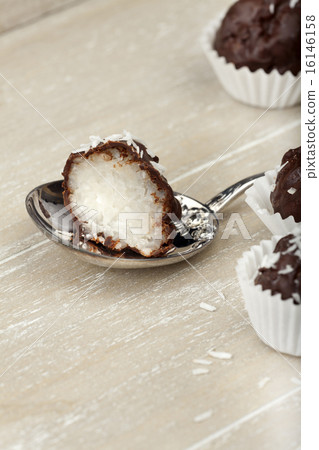 Coconut milk rice truffles on a silver spoon Coconut milk rice truffles on a silver spoon 16146158
