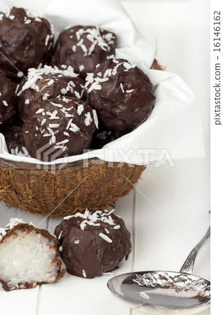 Coconut milk rice truffles with silver spoon 16146162