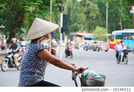 People riding a bicycle in Vietnam 16146512