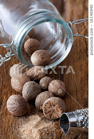 Some nutmeg in a glass 16146940