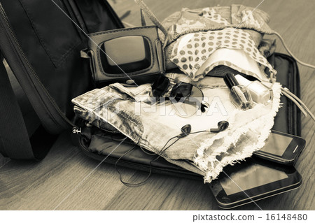 Open the suitcase with tourist things 16148480