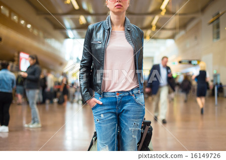 Female traveller walking airport terminal. Female traveller walking airport terminal. 16149726