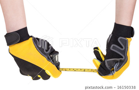 worker hands in safety gloves with measuring tape 16150338