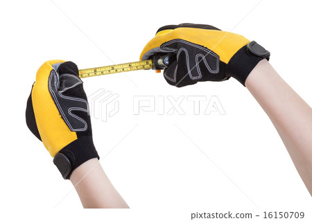 builder hands in safety gloves with measuring tape 16150709