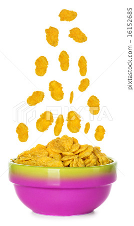 Flying corn flakes in a bowl isolated on white  16152685