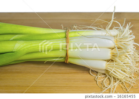 spring onion on a plank 16165455