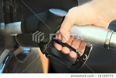 Refilling the car with unleaded petrol 16169559