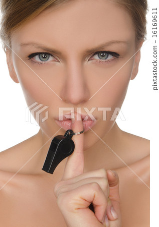 young woman holding finger and whistle before lips 16169611