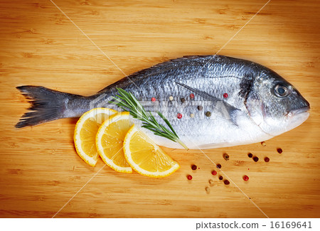 Fresh fish dorado on wooden background 16169641