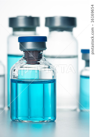 Vials of the vaccine, blue background 16169654