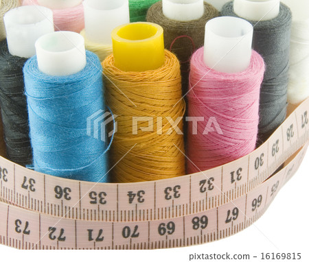 Many colorful threads with centimeters over background Many colorful threads with centimeters over background 16169815
