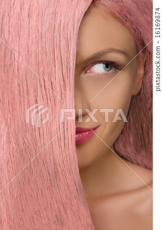 woman with pink hair looking to side woman with pink hair looking to side 16169874