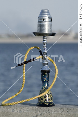 Turkish tobacco water hookah standing over the river background 16170089