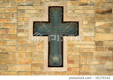 decorative metal cross on textured wall 16170182
