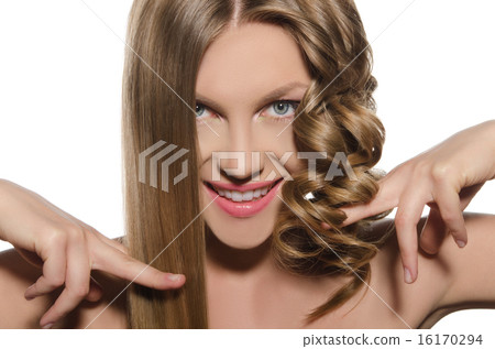 Woman with haircut keeps hair in hands 16170294