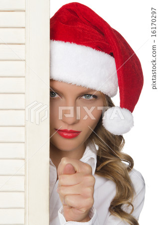offended woman in Santa hat showing bad gesture offended woman in Santa hat showing bad gesture 16170297