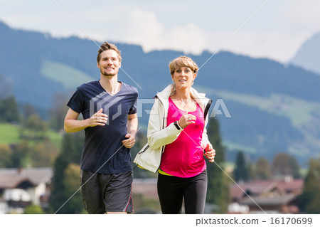 Couple doing sport running in the mountains 16170699
