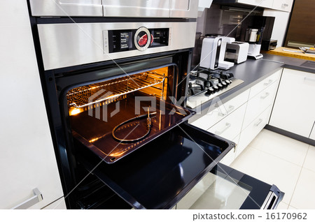 Modern hi-tek kitchen, oven with door open 16170962