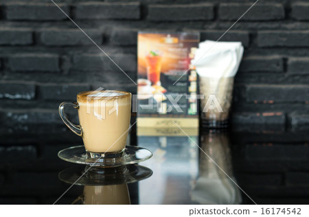 Coffee cup on the mirror table in coffee shop 16174542