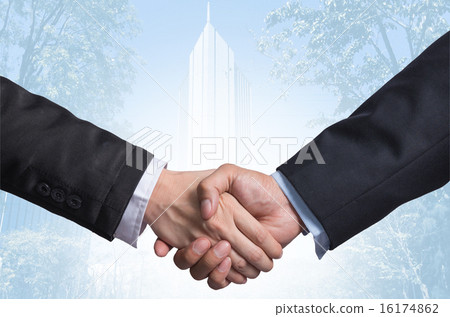 Hand shake between a businessman on Modern glass building backgr 16174862