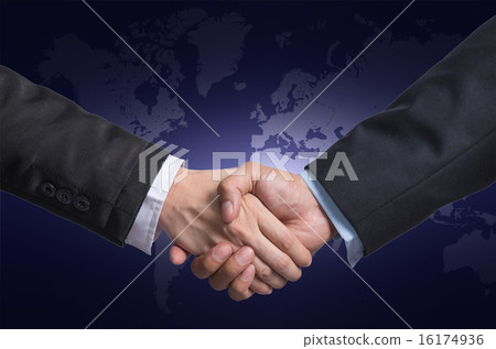 Hand shake between a businessman and a businesswoman on world ma Hand shake between a businessman and a businesswoman on world ma 16174936