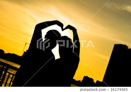Romantic lovers with bubbles at sunset background, Silhouette co Romantic lovers with bubbles at sunset background, Silhouette co 16174985