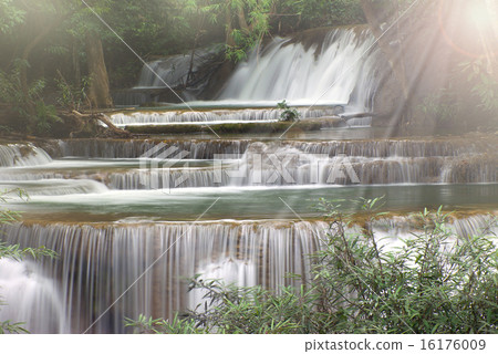 Beautiful waterfall with sun ray the forest Beautiful waterfall with sun ray the forest 16176009