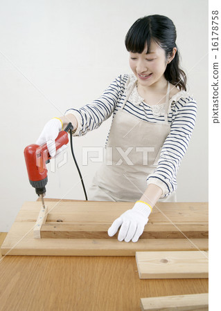 Driver - a young woman using Driver - a young woman using 16178758