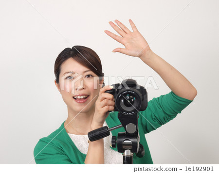 A woman shooting while talking to the model 16192901