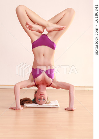 Woman doing headstand in lingerie 16196841