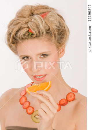 young blond woman with strawberry-kiwi-chain young blond woman with strawberry-kiwi-chain 16196845
